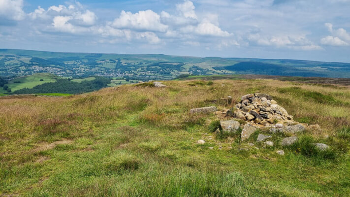 Stone cairn and grass on Eyam Moor