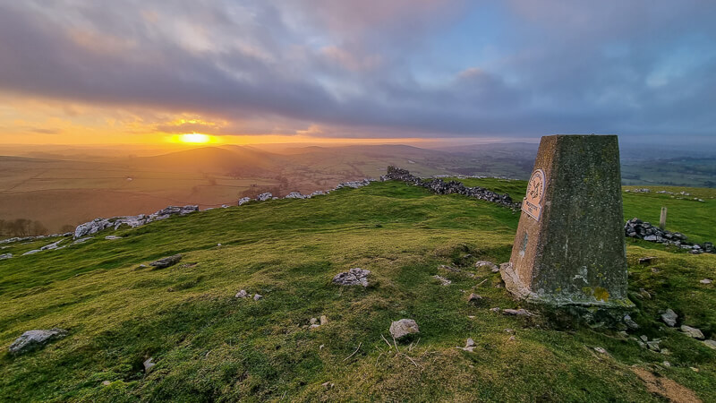 Wolfscote Hill trig point at sunset